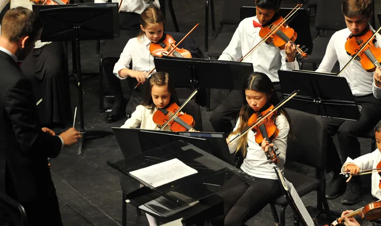 Young string players of the Sinfonia Strings in performance